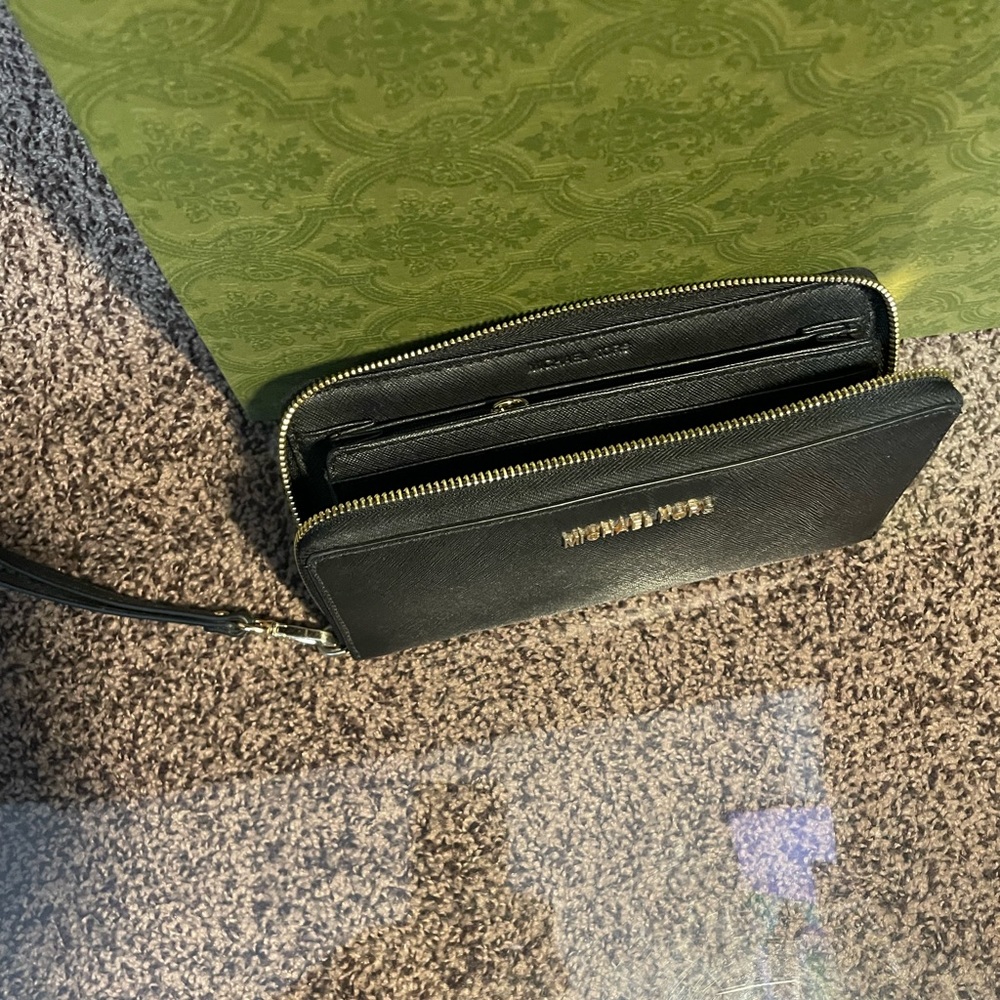 Michael Kor wallet with gold zipper, can be yours for $60.00